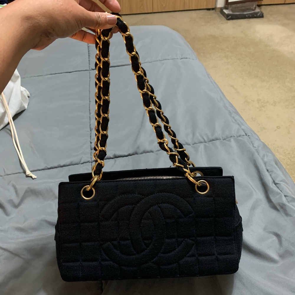 Authentic Chanel black jersey in 24k gold hardware